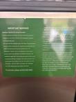 Green warning label on the door about condenser cleaning and preventive maintenance