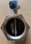 Looking into the threaded port of a butterfly valve, showing the disc and stem