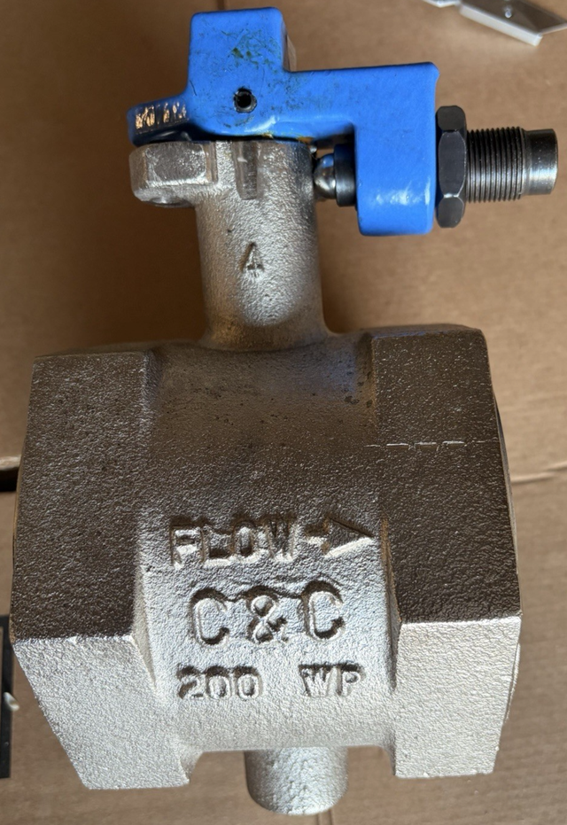 C&C 4-inch threaded butterfly valve from above: blue handle, black stem nut, FLOW and 200 WP cast on the body