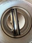 Low-resolution close-up of a butterfly valve disc and stem inside the bore