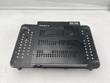 Top of the black Enterasys D2G124-12P switch, perforated cover, on a black riser