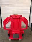 End of the red Cambro carrier with two clear-windowed doors closed, gray bumper rail and casters