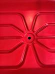 Ribbed floor of the red carrier well with a center drain hole