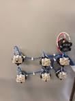 Six Eaton pushbutton contact blocks with blue wiring on the back of the control panel door