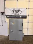 Gray SCE industrial control panel enclosure with pushbuttons, emergency stop and programming port, door closed