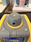 Rotor head dome of the LL100N rotary laser level with the laser aperture, above the control panel