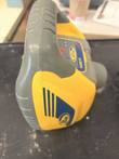 Yellow and gray Spectra Precision laser level seen from the side and above, with handle and blue striped side panel