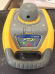 Spectra Precision LL100N rotary laser level, front view showing keypad, green indicator light and handle