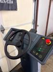 Nilfisk Liberty SC60 operator console: steering wheel, touchscreen, red emergency stop and button panel