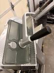 Gray product holder pad with aluminum arm and black handle over the ribbed carriage tray, Bizerba SE 12 D