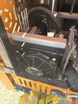 Hydraulic oil cooler with electric cooling fan inside the crusher frame