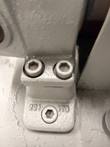 Cast pump bracket with two socket-head bolts and a hex mounting screw