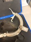 Rotary peeler ring opened with latch lever raised, 6" IPS cutter block and black handle in blue case; left cropped